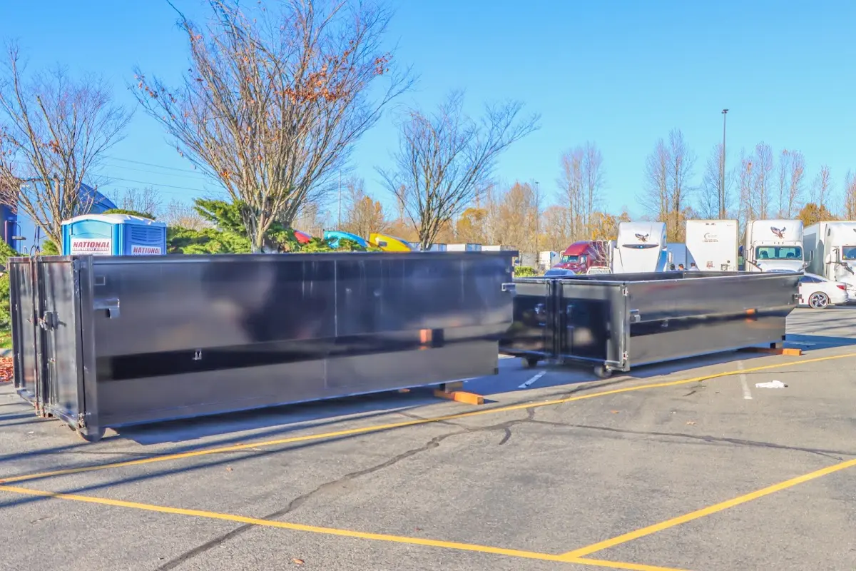 Professional dumpster rental service with roll-off container on residential driveway in Fellsmere